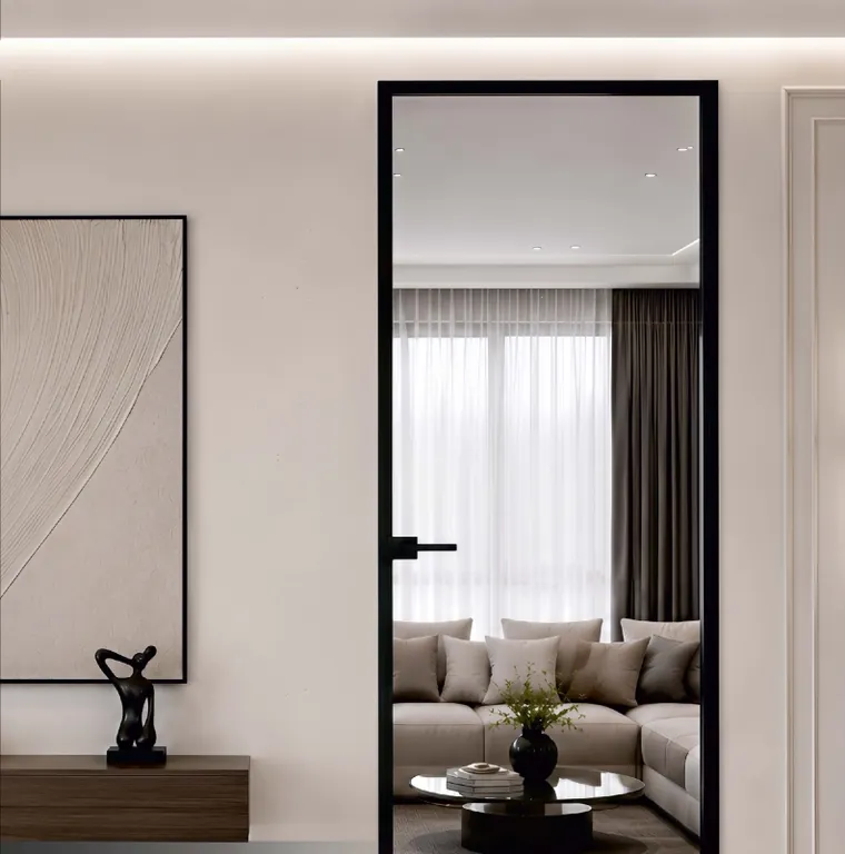 Mirage swing door in Munich Black, opening onto a living room
